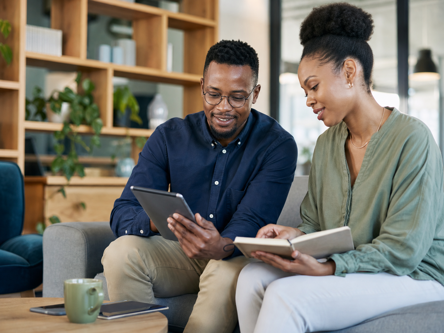 Two people reviewing flexible investment options on a tablet